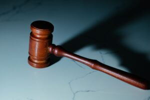 a wooden gavel casting a shadow